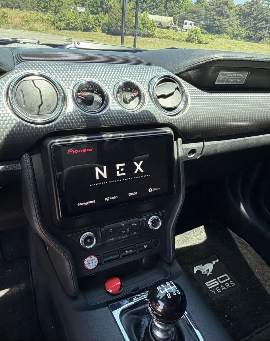 Same Mustang dash with a Pioneer NEX touchscreen head unit installed